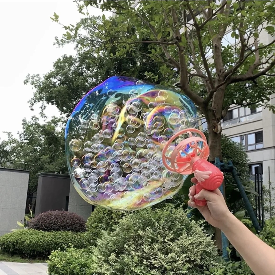 Electric Bubble Gun for Creating a Giant Bubble Filled with Mini Bubbles Electric Bubble Gun for Creating a Giant Bubble Filled with Mini Bubbles