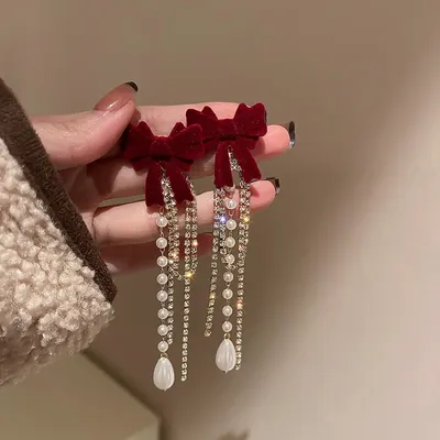Long Pearl Earrings with a Fashionable Bowknot at the Top End Long Pearl Earrings with a Fashionable Bowknot at the Top End