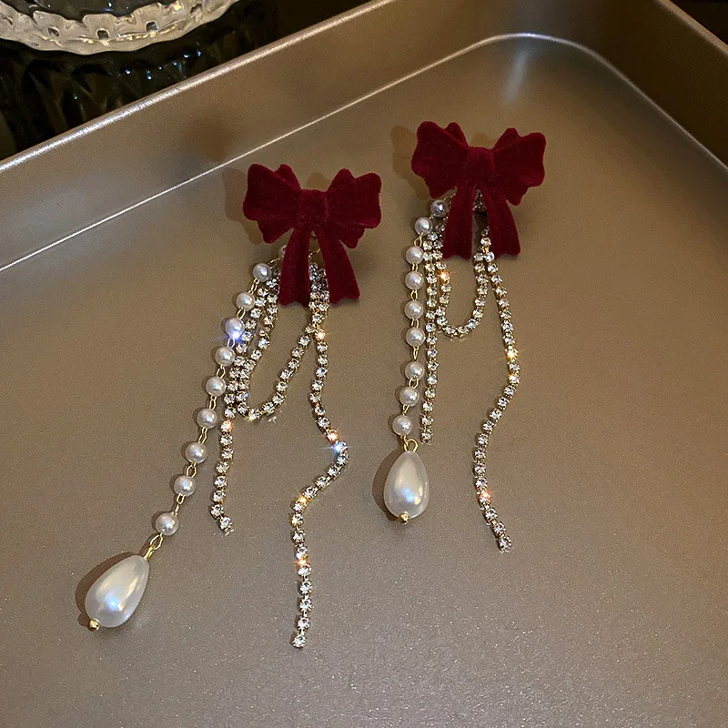 Long Pearl Earrings with a Fashionable Bowknot at the Top End Long Pearl Earrings with a Fashionable Bowknot at the Top End