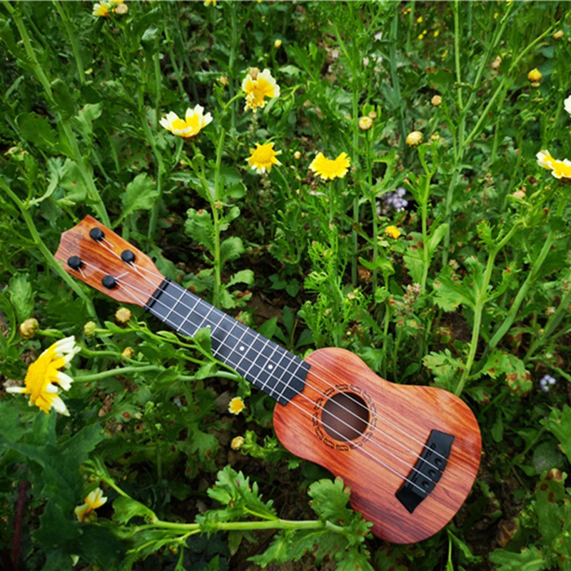 Mini Guitar 4 Strings Classical Ukulele Guitar Toy Musical Instruments For Kids Beginners Early Education Ukulele Mini Guitar 4 Strings Classical Ukulele Guitar Toy Musical Instruments For Kids Beginners Early Education Ukulele