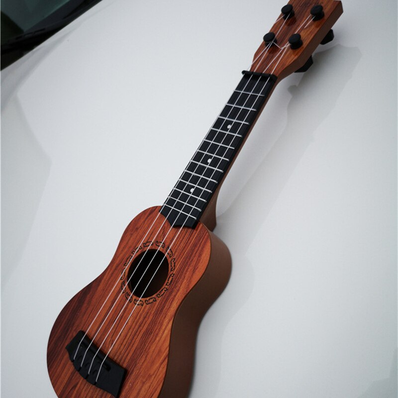 Mini Guitar 4 Strings Classical Ukulele Guitar Toy Musical Instruments For Kids Beginners Early Education Ukulele Mini Guitar 4 Strings Classical Ukulele Guitar Toy Musical Instruments For Kids Beginners Early Education Ukulele