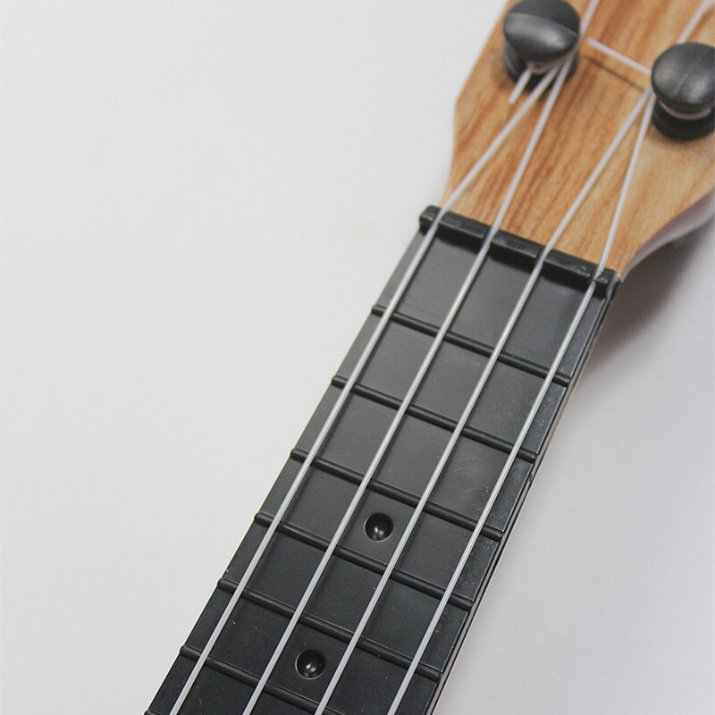 Mini Guitar 4 Strings Classical Ukulele Guitar Toy Musical Instruments For Kids Beginners Early Education Ukulele Mini Guitar 4 Strings Classical Ukulele Guitar Toy Musical Instruments For Kids Beginners Early Education Ukulele