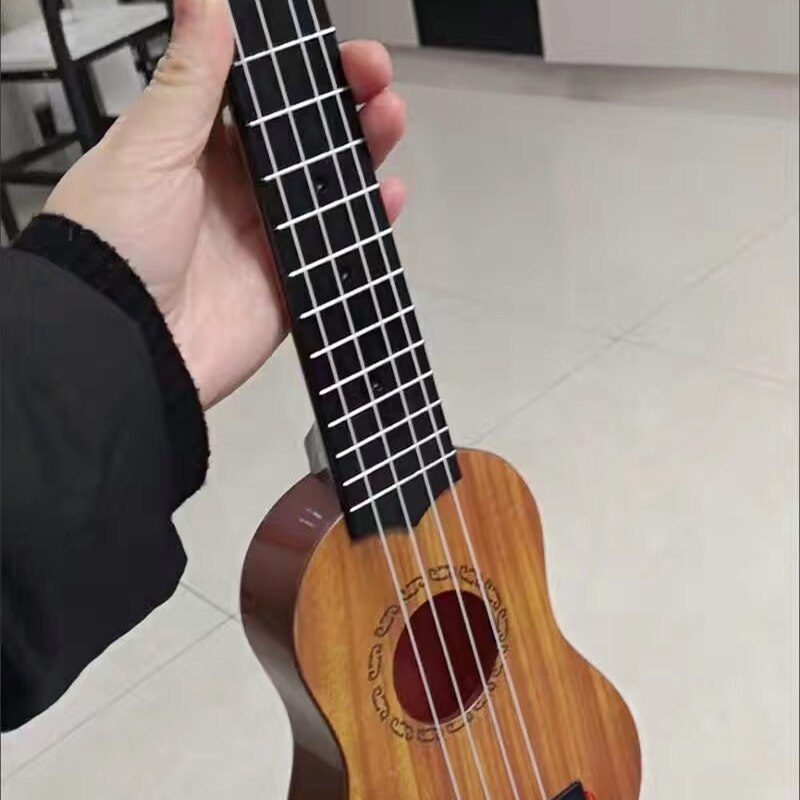 Mini Guitar 4 Strings Classical Ukulele Guitar Toy Musical Instruments For Kids Beginners Early Education Ukulele Mini Guitar 4 Strings Classical Ukulele Guitar Toy Musical Instruments For Kids Beginners Early Education Ukulele