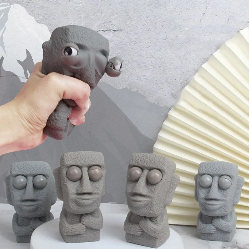 Stone Man Releases Stress Toy Slowly Rebounds Soft Moai Statue Squeeze Eyes Interested Expression Relaxes Stress